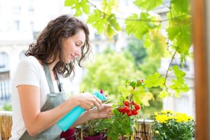 woman watering plant using gardening as therapy