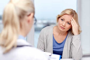 Woman in PTSD treatment program talks to therapist about her trauma