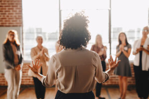 Woman talks to peers in group therapy